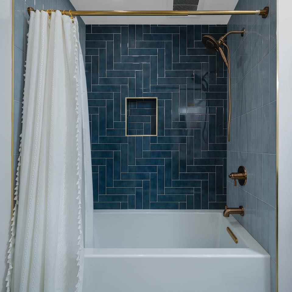 Herringbone Tile Creates a Dramatic Shower Accent