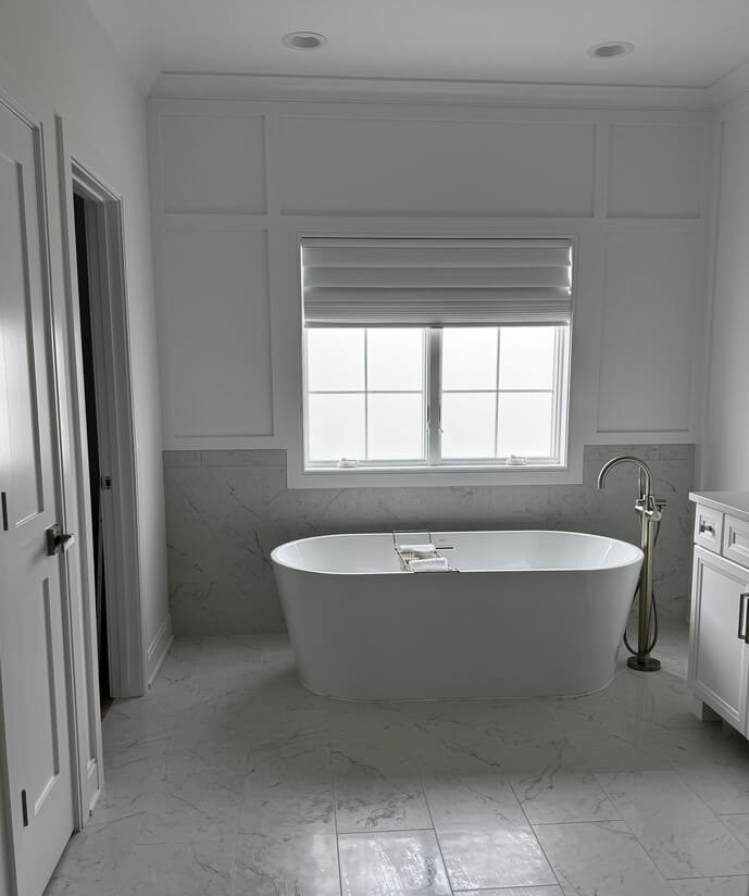 White Roman Shade Offers Clean Privacy for Bathroom Window
