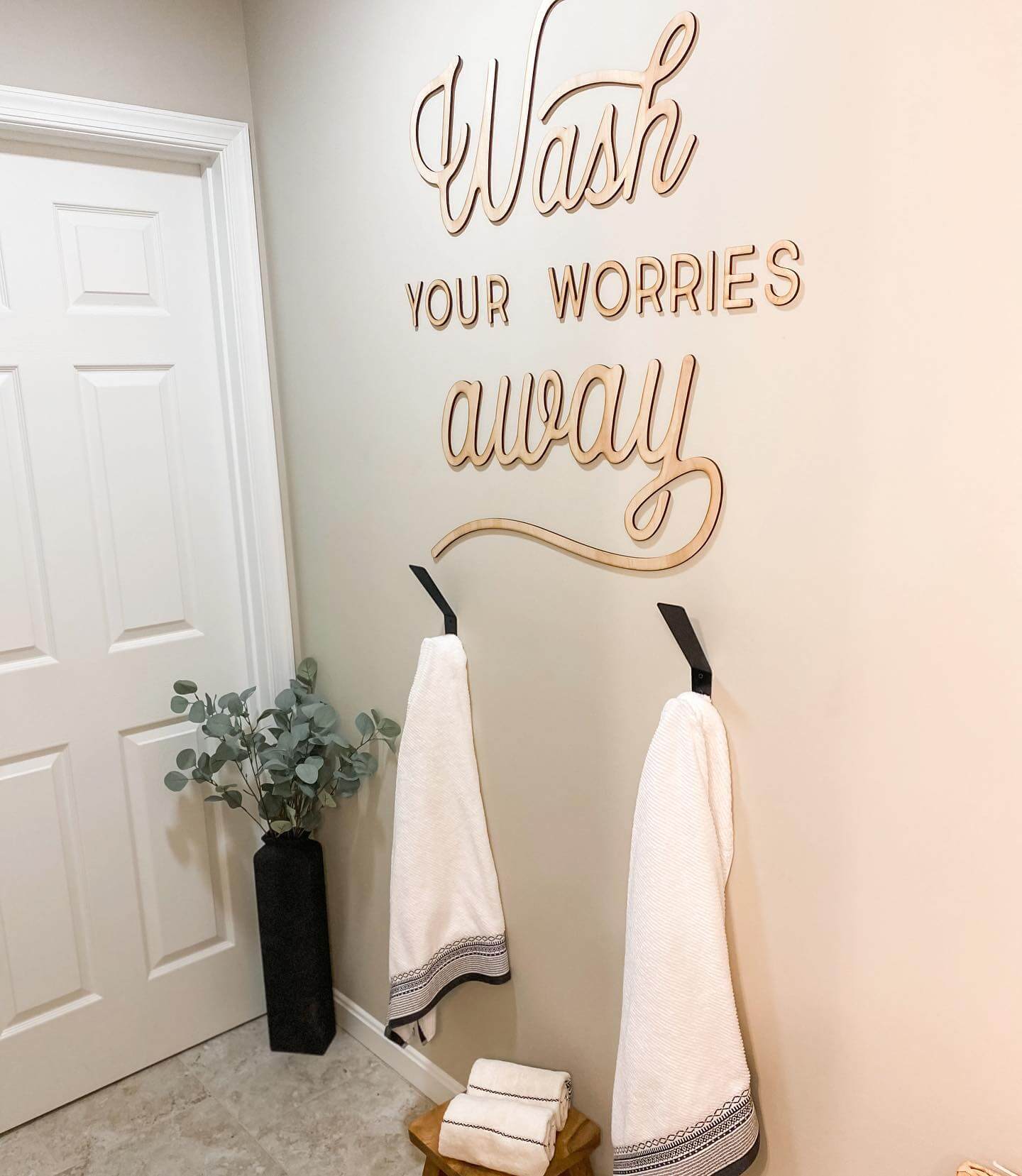 Wooden Script Signage Offers a Playful Bathroom Mantra