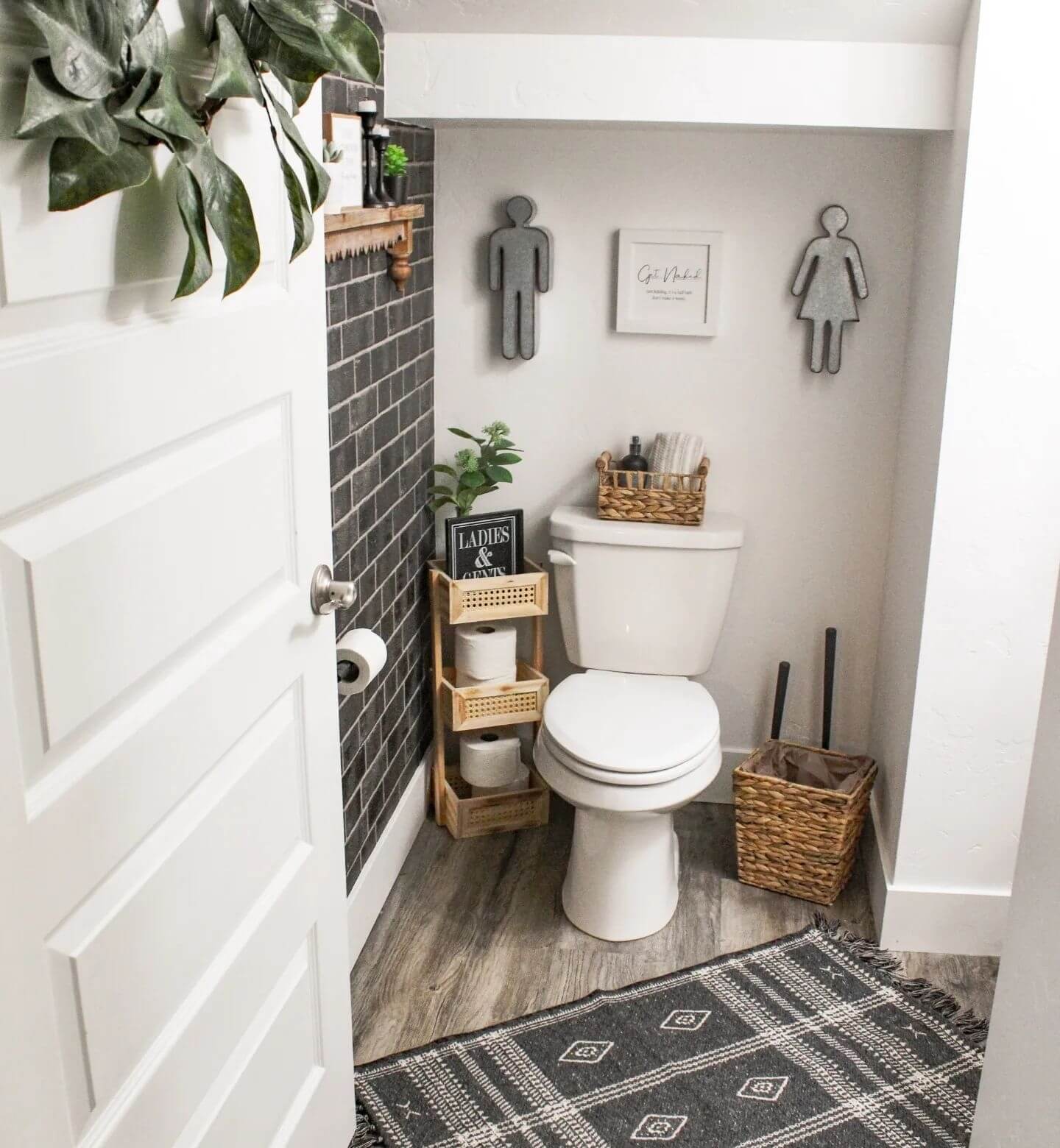 Metal Figures Add Playful Bathroom Signage