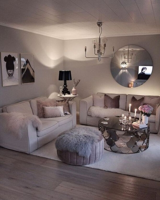 Round Mirror Reflects Chandelier and Adds Depth