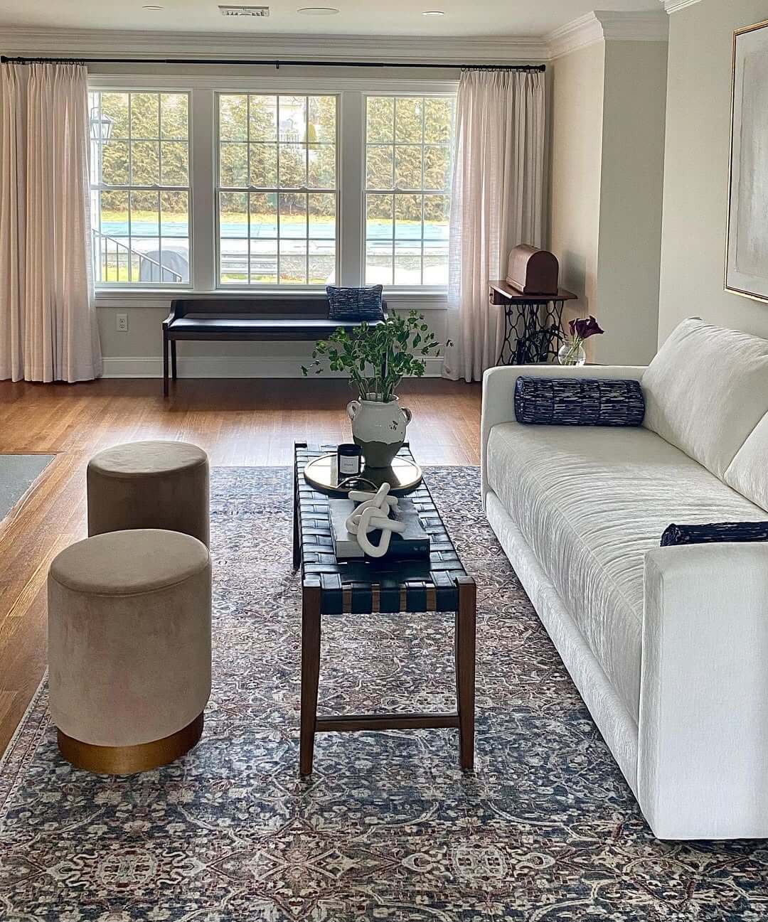 Incorporate Soft Seating with Round Velvet Ottomans