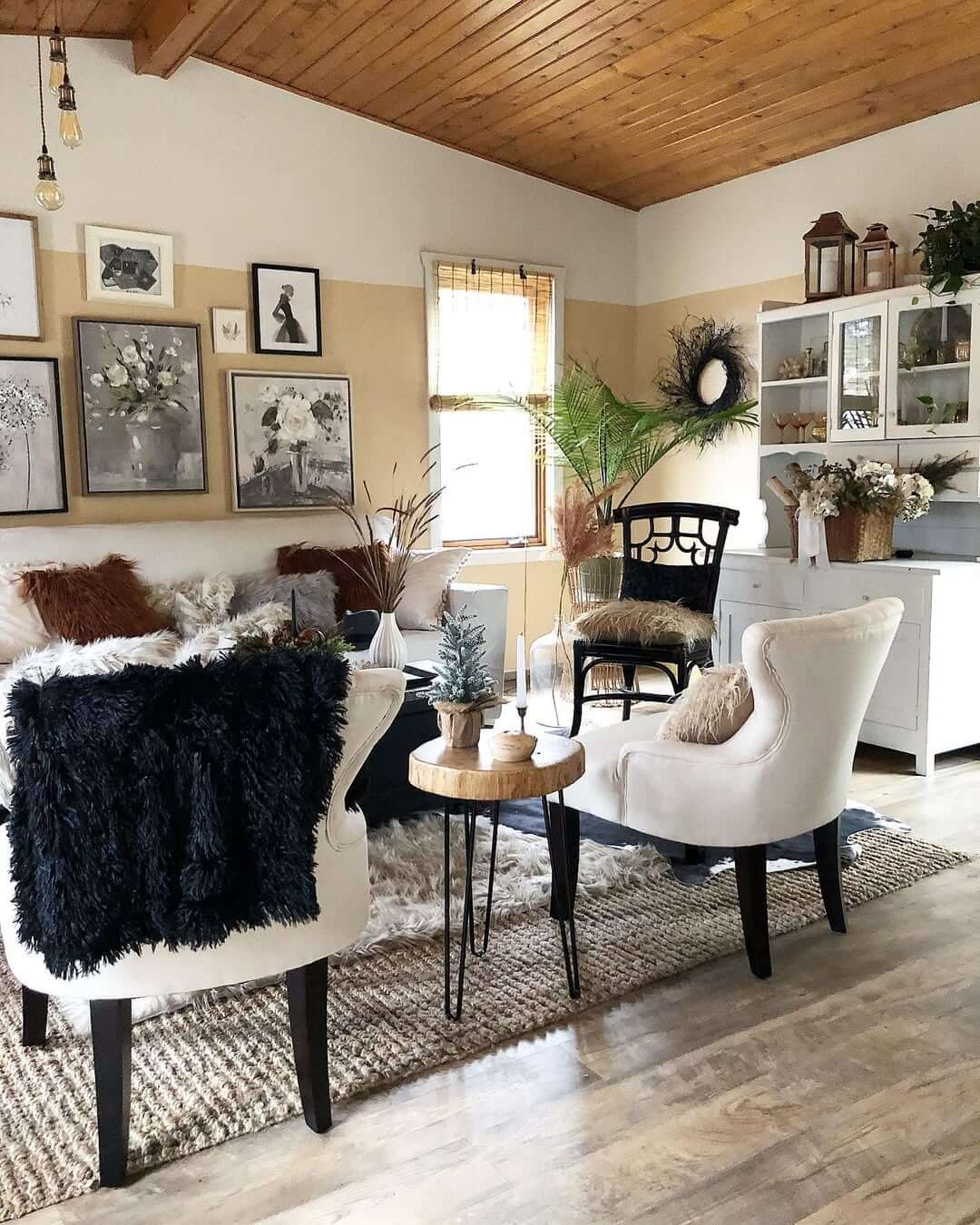 Grouped Artwork Creates a Gallery Wall Above the Sofa