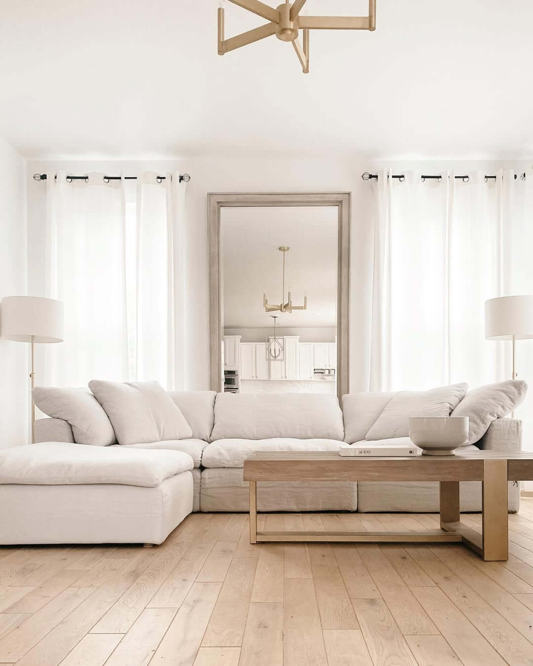 Oversized Floor Mirror Reflects Kitchen Area