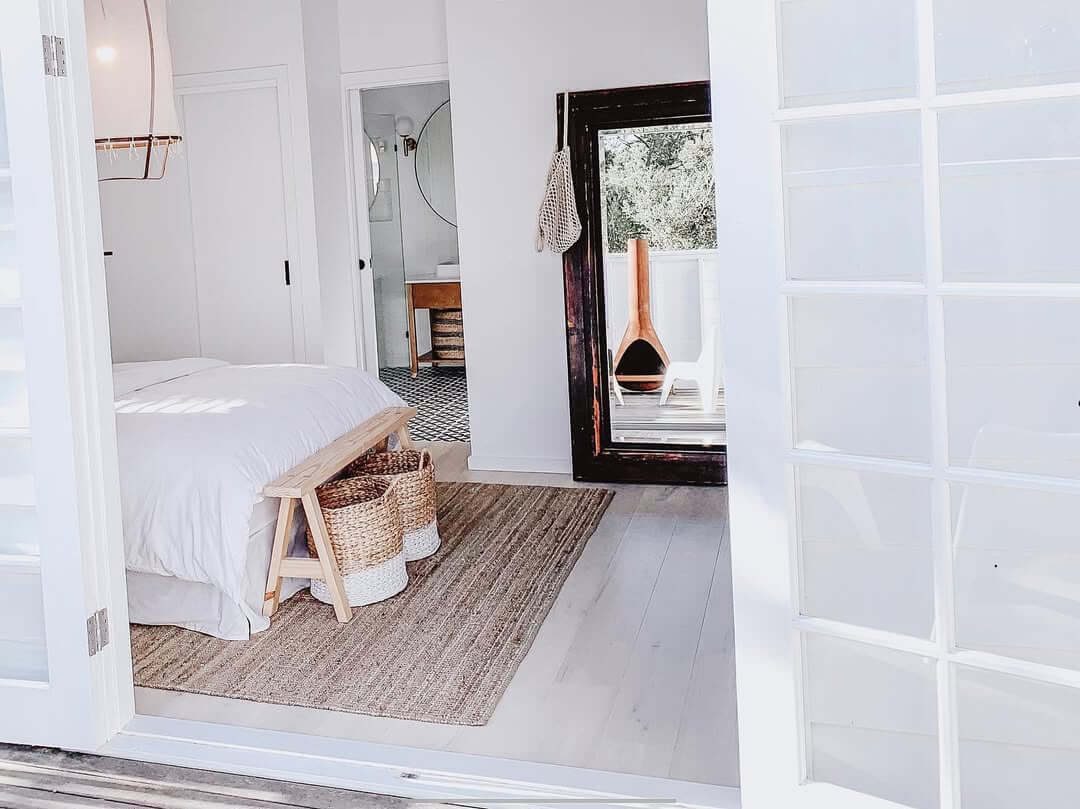 Ground Your White Bedroom with a Natural Jute Rug