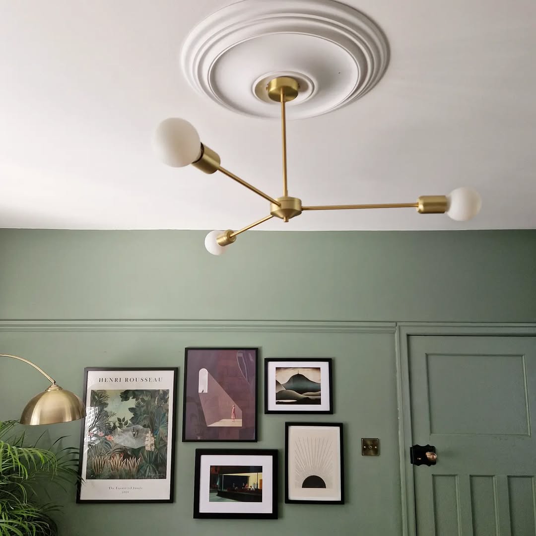 Group Varied Art Styles for a Dynamic Gallery Wall