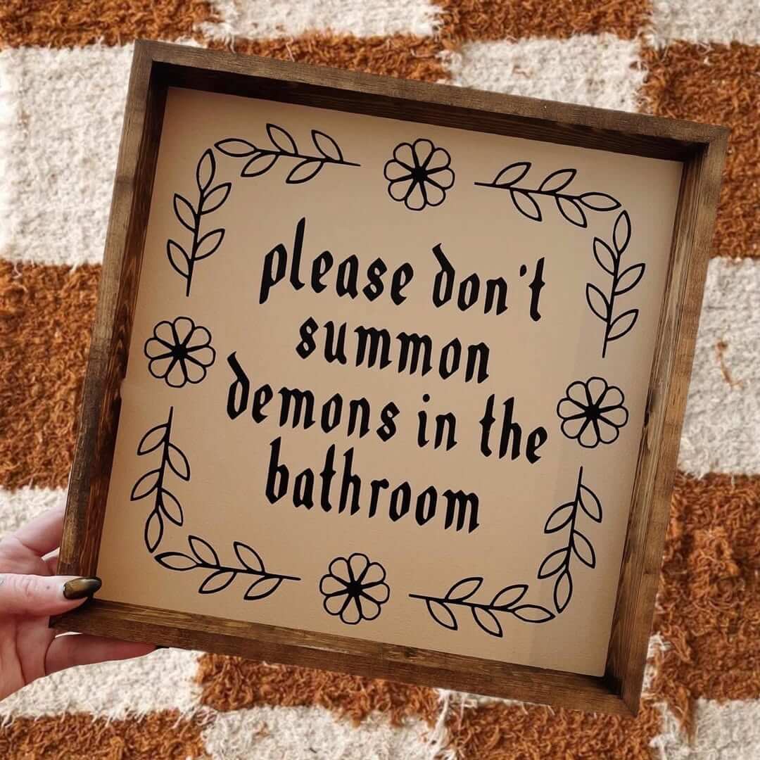 Dark Wood-Framed Sign with Whimsical Floral Border