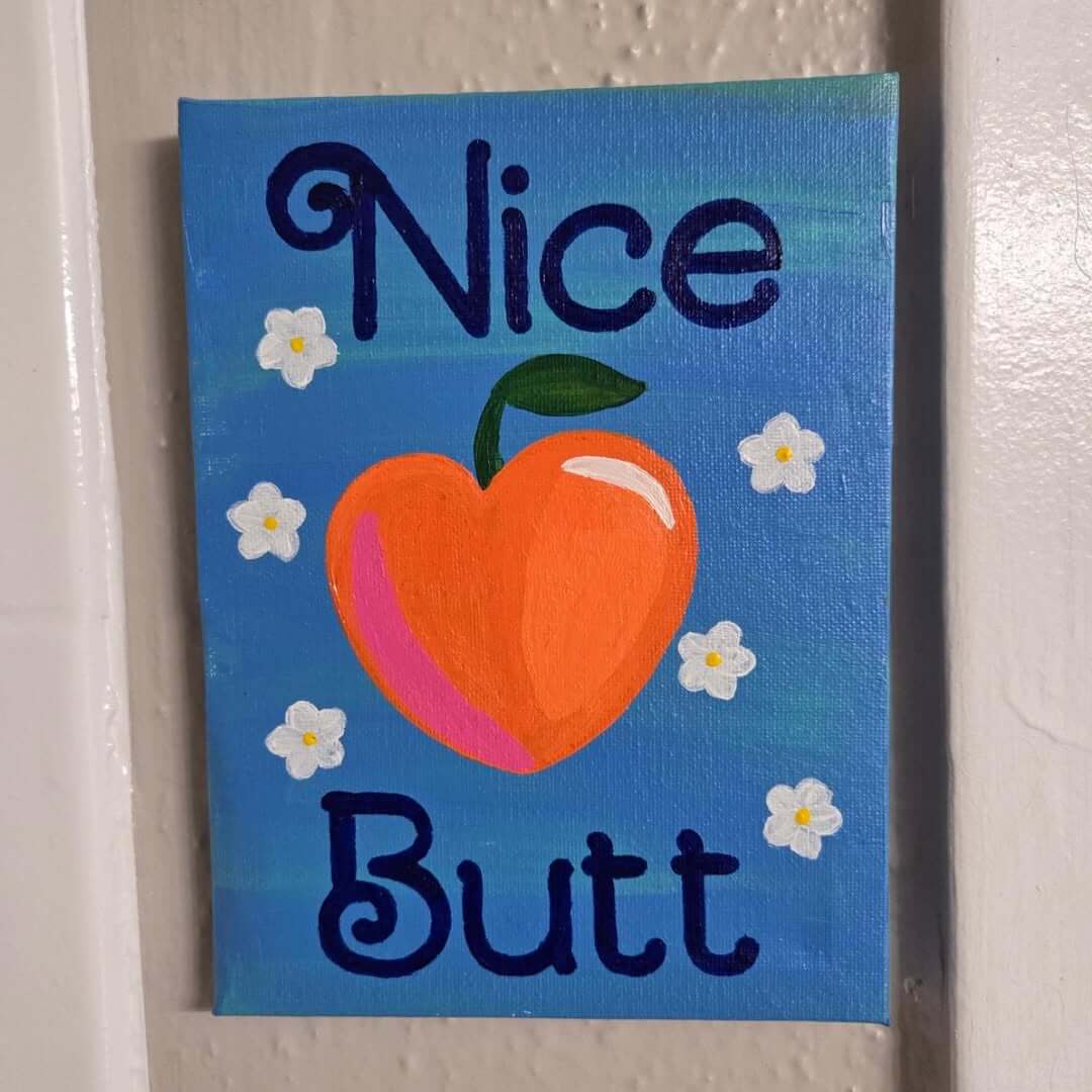 Hand-Painted Canvas Sign with 'Nice Butt' Message