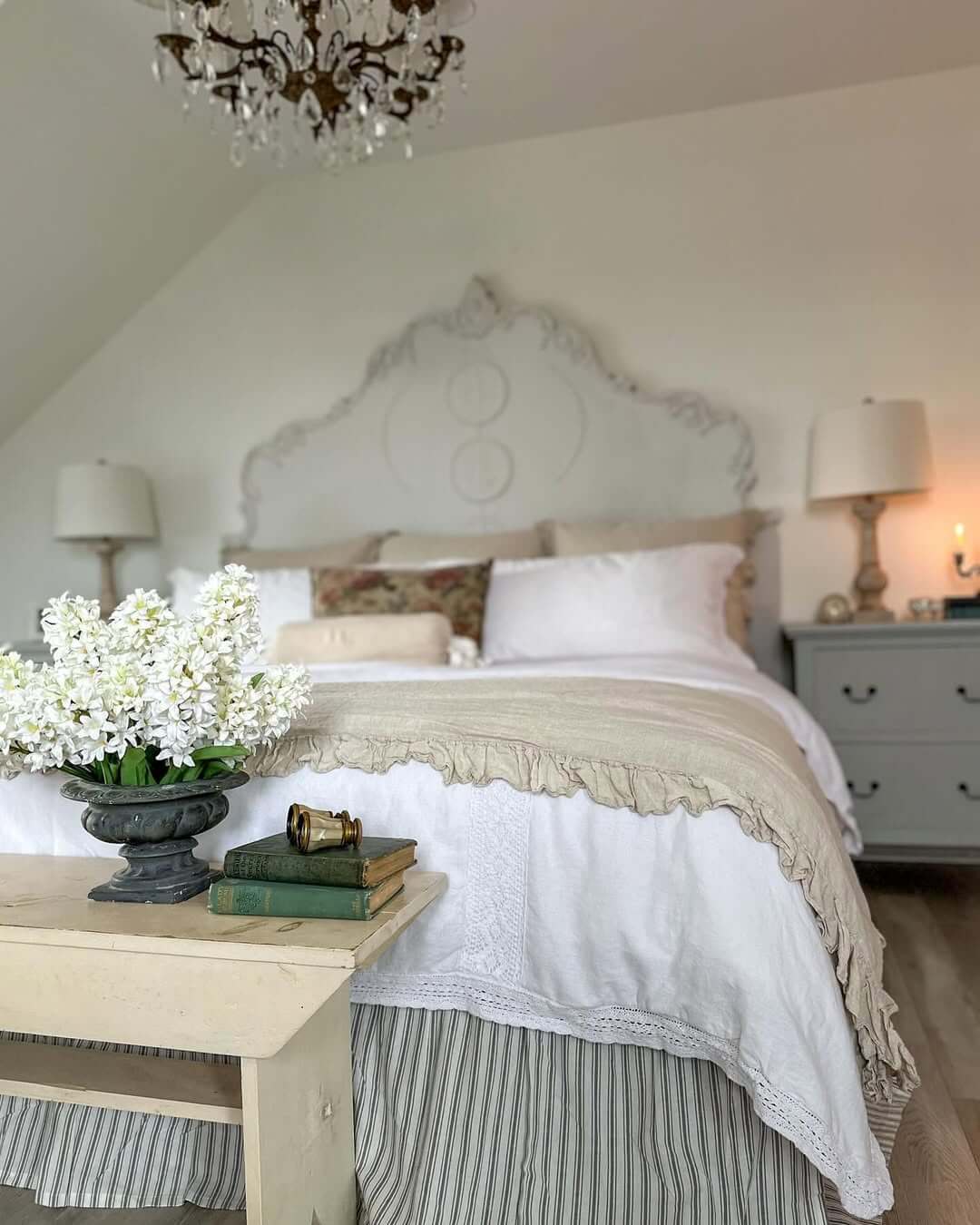 Ornate White Headboard Adds Romantic Flourish Above the Bed