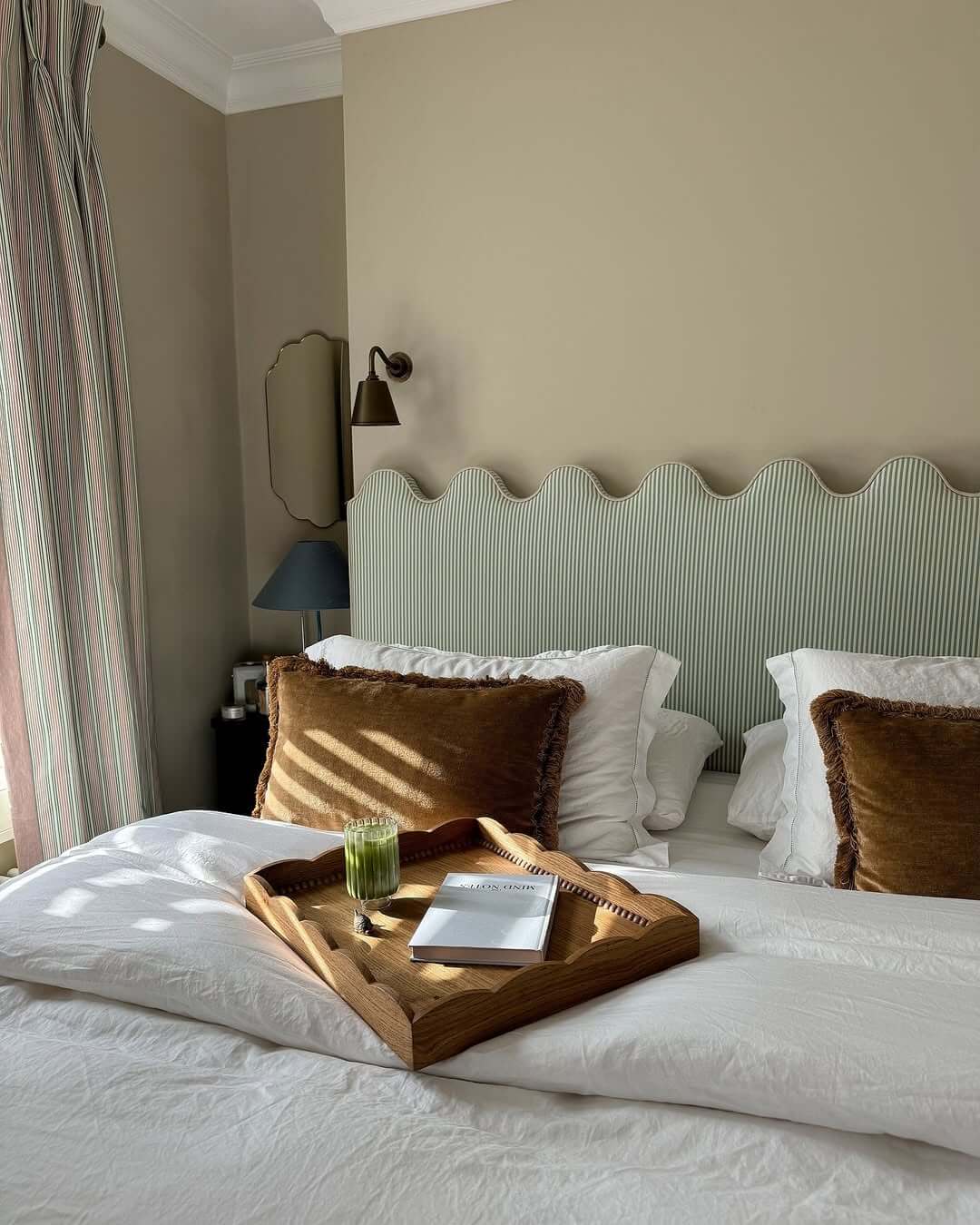 Scalloped Headboard Adds Soft Curves Above the Bed