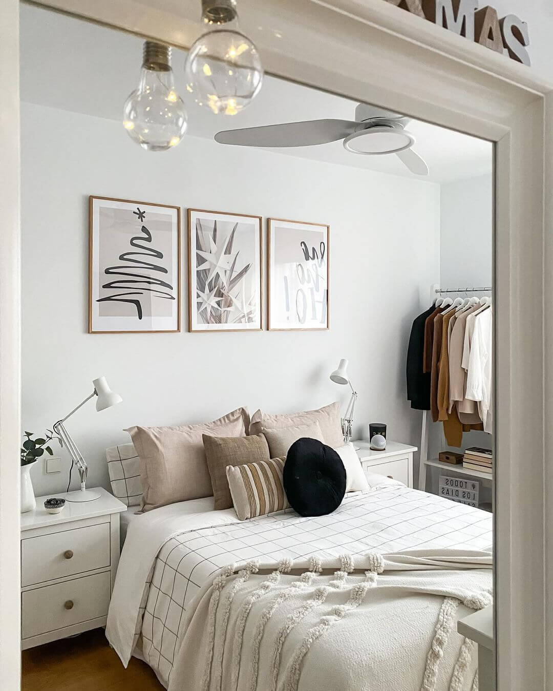 Three Framed Prints Create a Minimalist Art Moment Above the Bed
