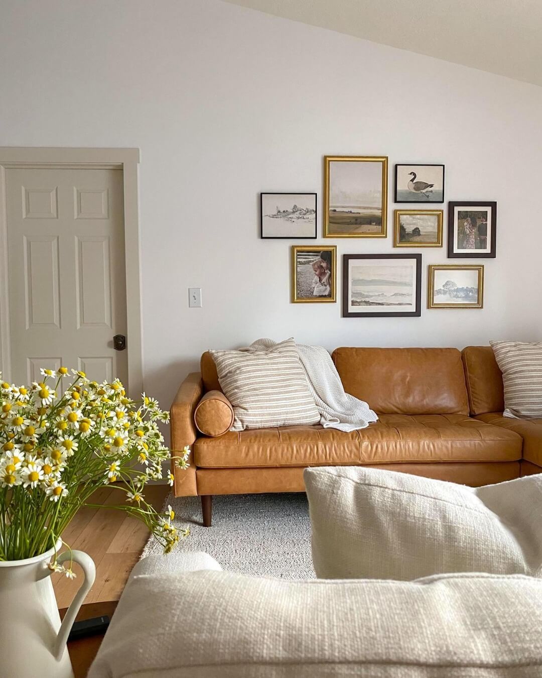 Gallery Wall With Varied Gold and Black Frames