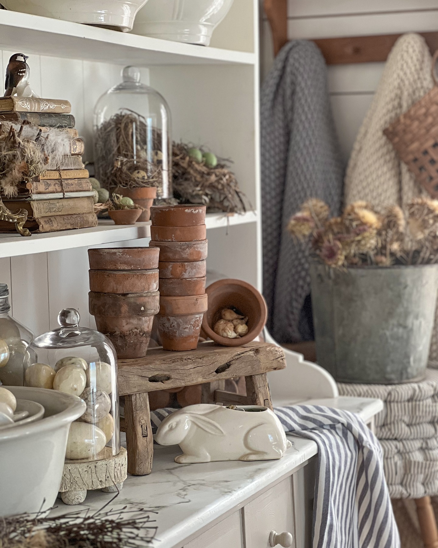 Stack Weathered Terracotta Pots on a Rustic Wooden Stand