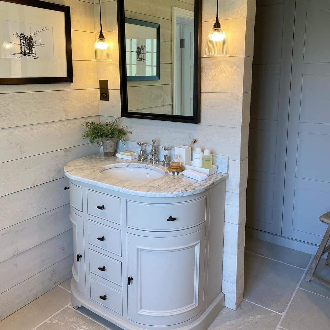Curved Vanity with Marble Top Adds Softness to the Bathroom