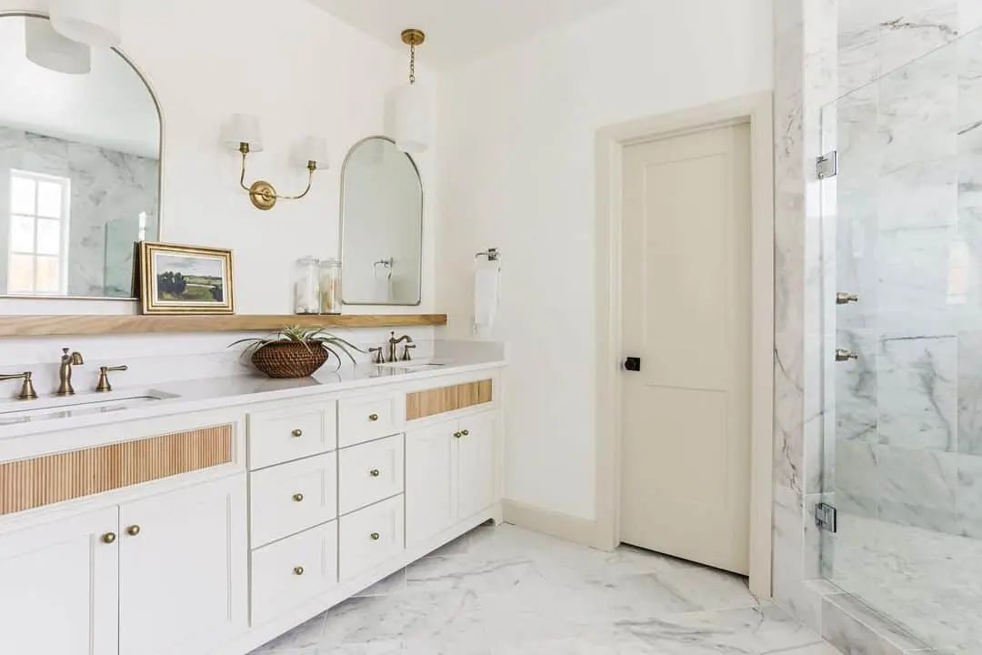 Fluted Wood Panels Add Warm Texture to White Vanity