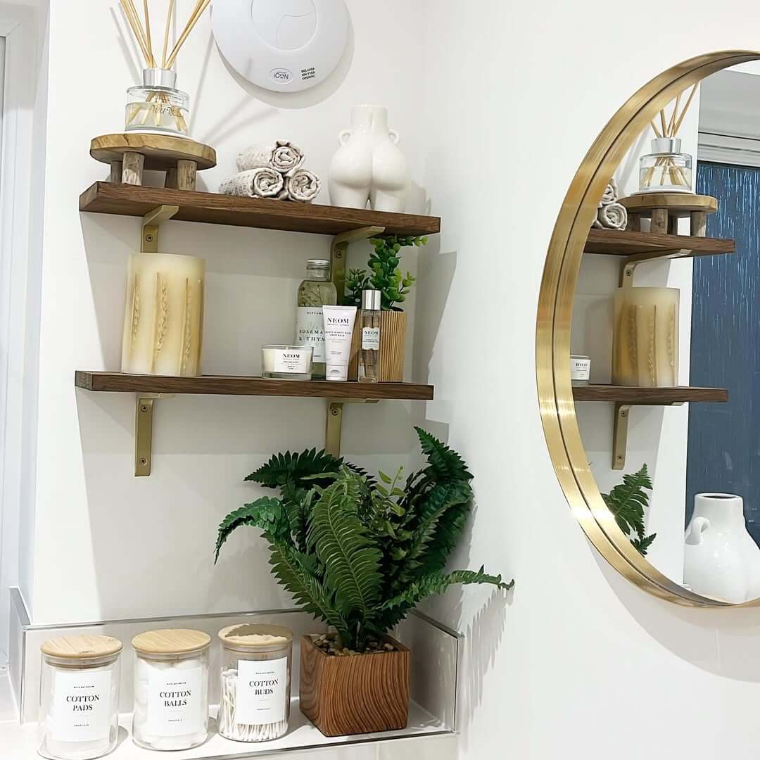 Wooden Pedestals Raise Reed Diffusers and Towels