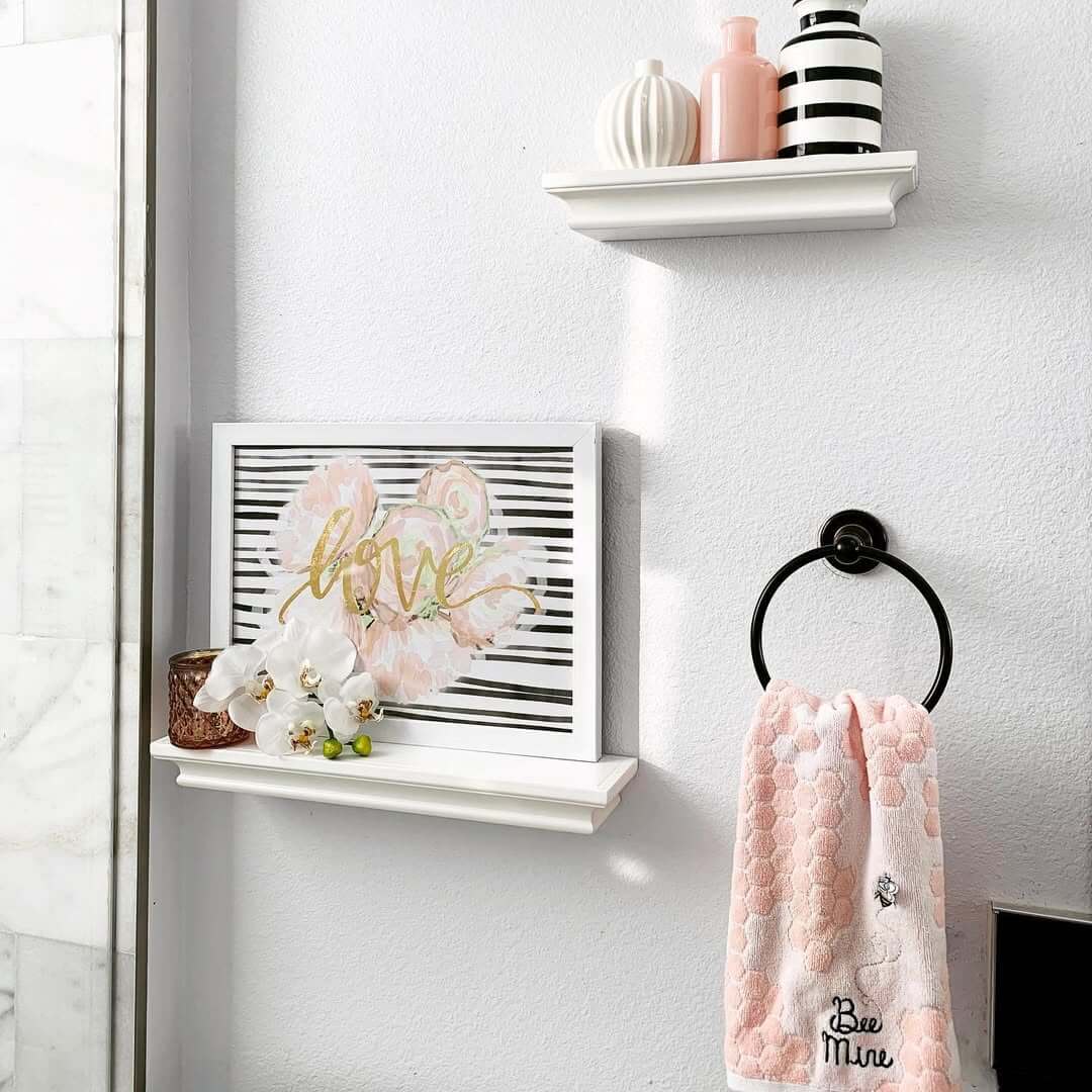 Soften a White Shelf with Framed Art and Orchids