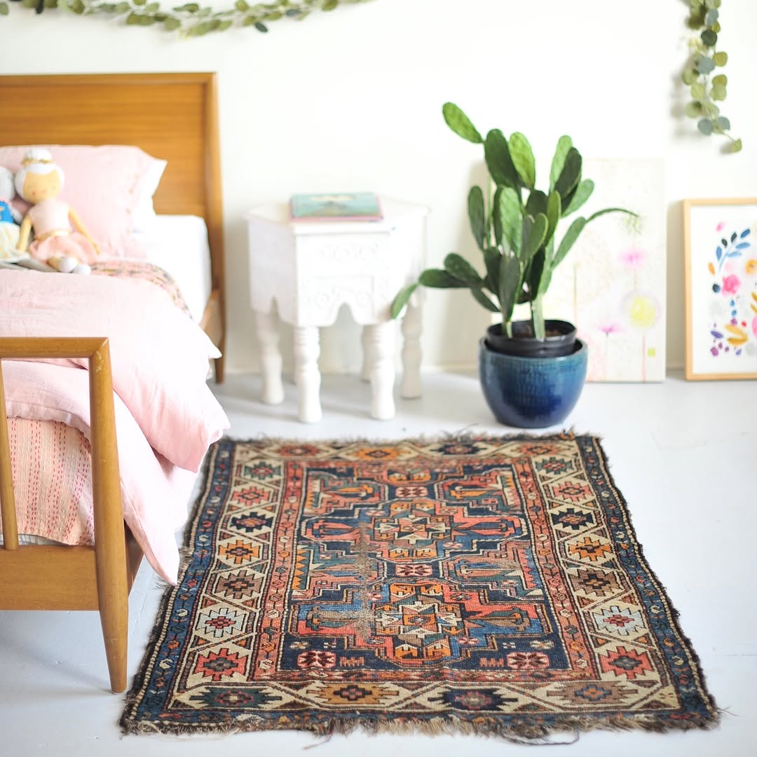 Ornate Medallion Rug Anchors a Colorful Bedroom