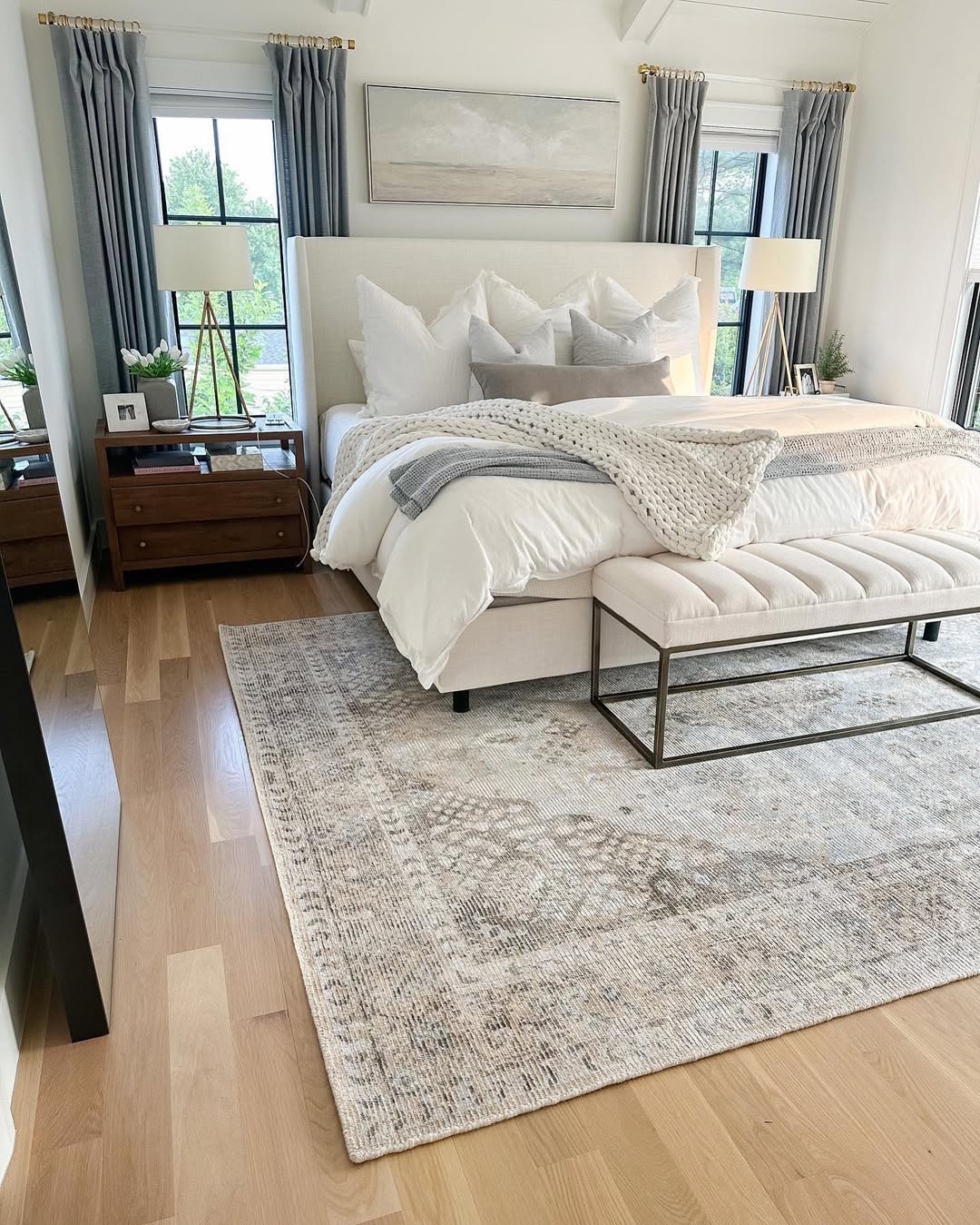 Faded Oriental Rug Adds Layered Texture to a Neutral Bedroom