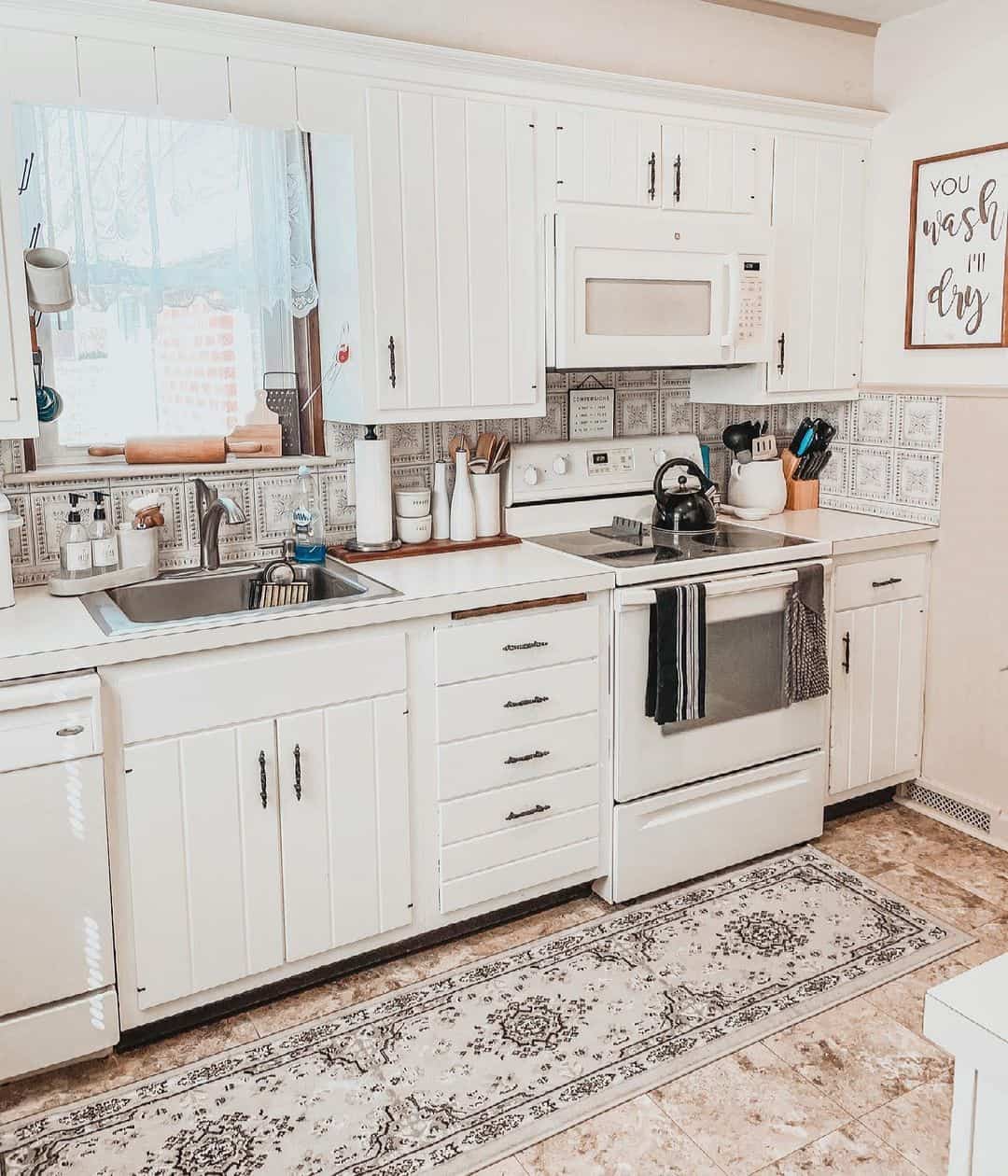 White Beadboard Cabinets With Dark Drawer Pulls