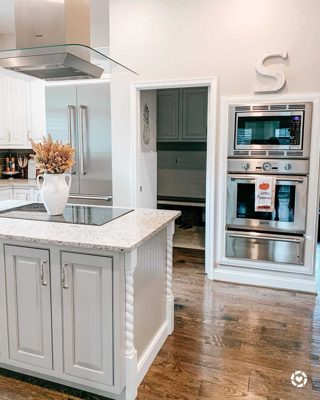 Beige Kitchen Island With Twisted Column Details
