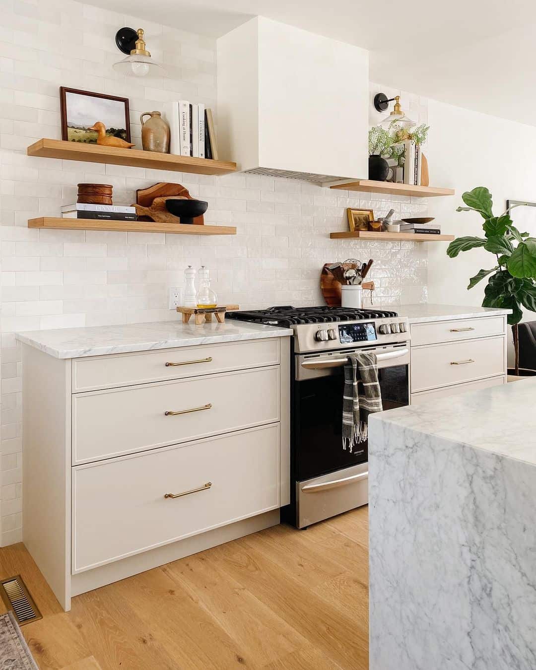 Beige Drawer Fronts with Brass Pulls Add Subtle Warmth