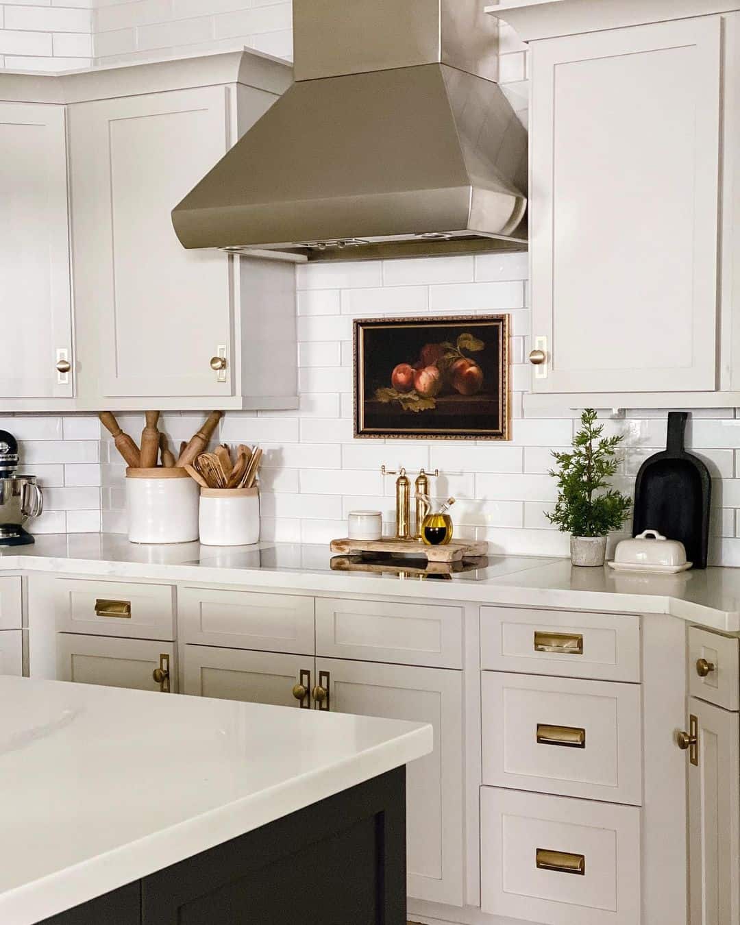 Vintage Still Life Painting Adds Warmth to Beige Kitchen Walls