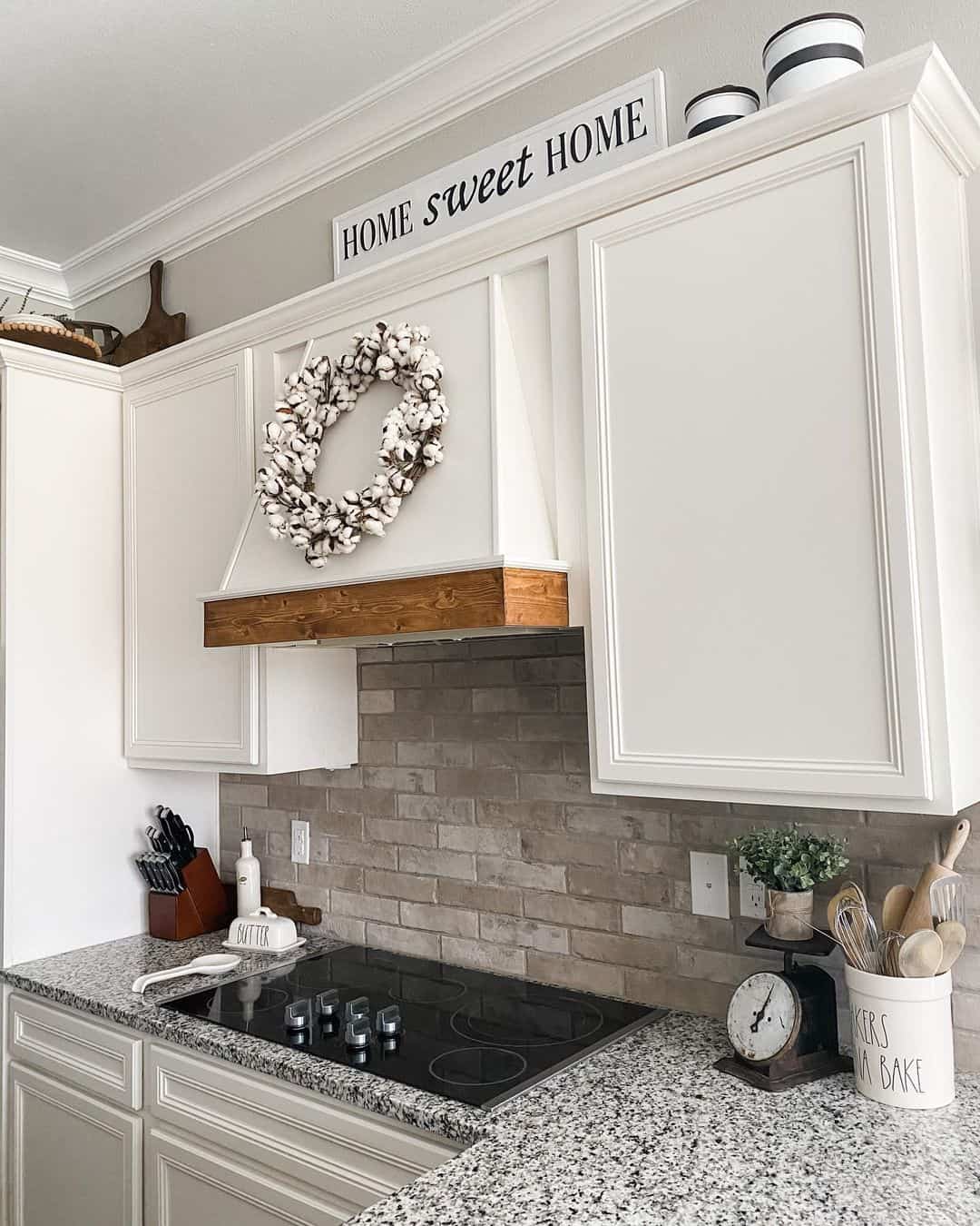 Contrast White Cabinets with a Grey Brick Backsplash