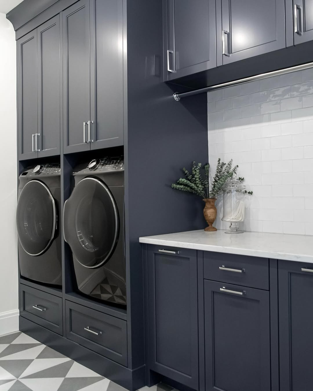 Dark Navy Cabinets Frame Stacked Washer and Dryer