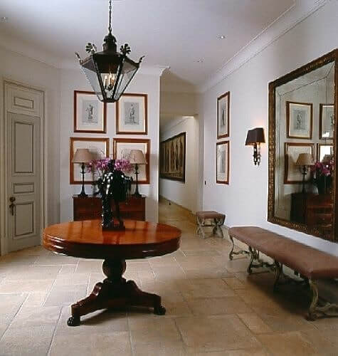 Polished Wood Round Table with a Dramatic Black Sculpture