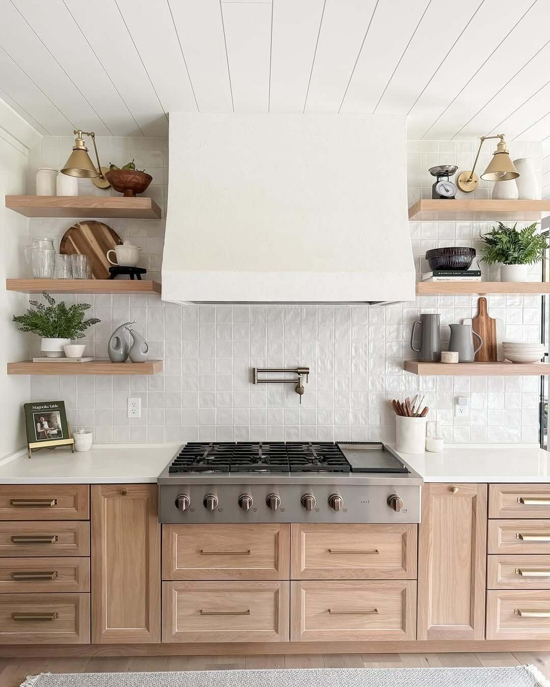 Brass Sconce Lights Highlight Items on Open Shelves