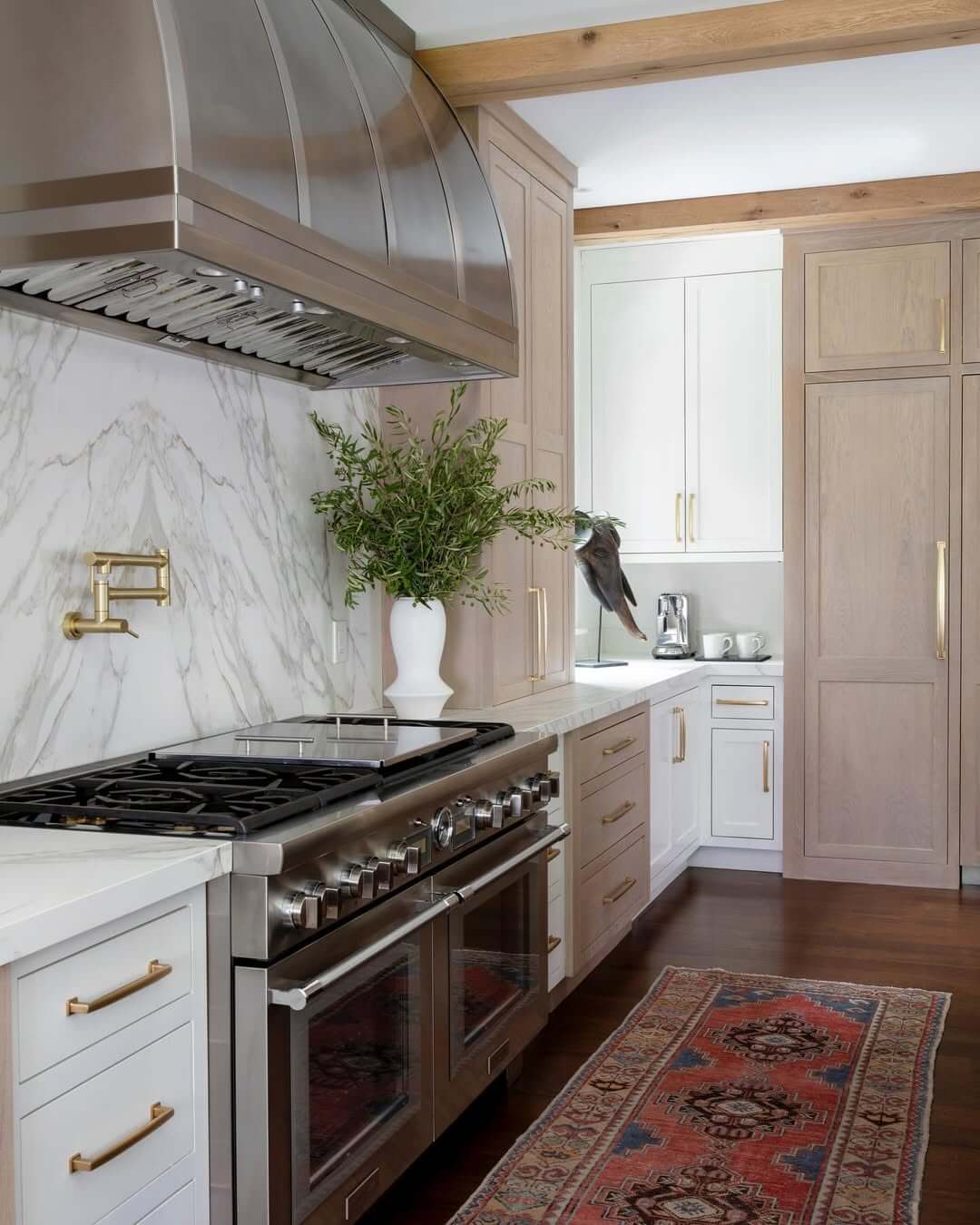 Brass Pot Filler Faucet Anchors Marble Backsplash