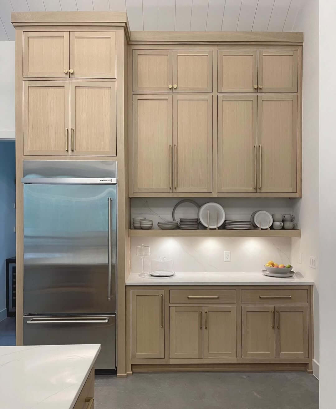 Floating Oak Shelf with Integrated Lighting Displays Dinnerware