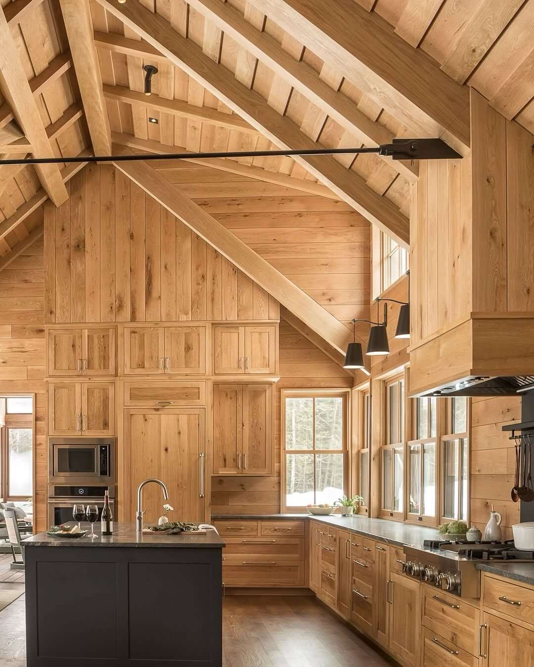 Bold Contrast: White Oak Cabinets Paired With a Dark Island