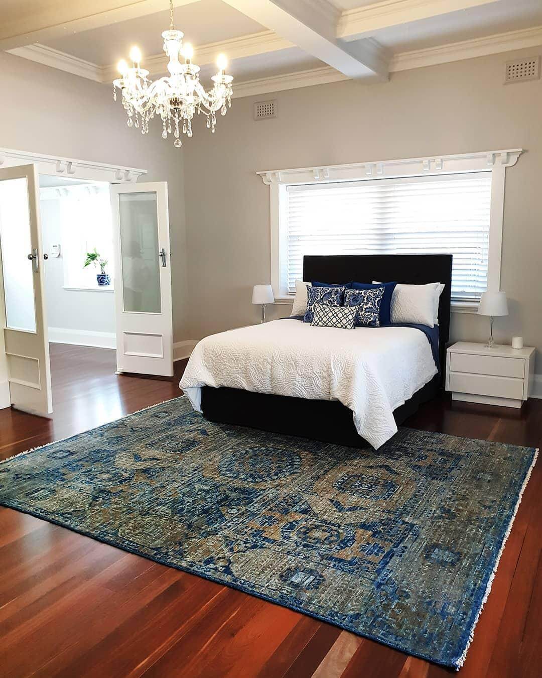 Anchor Your Bed with a Distressed Blue and Gold Rug