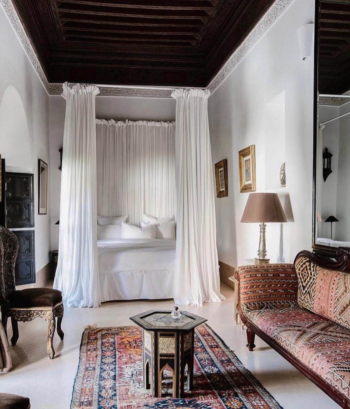 Drapery Creates a Canopy Effect Around the Bed