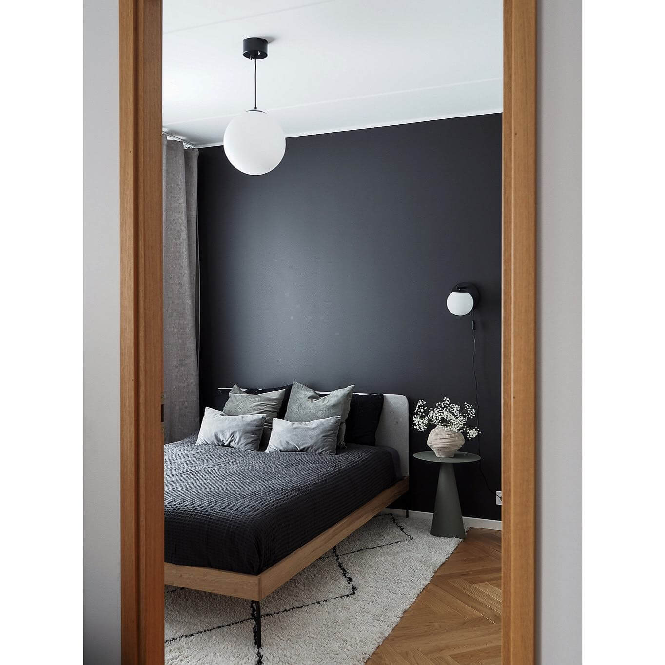 Matte Black Wall with a Simple Globe Pendant
