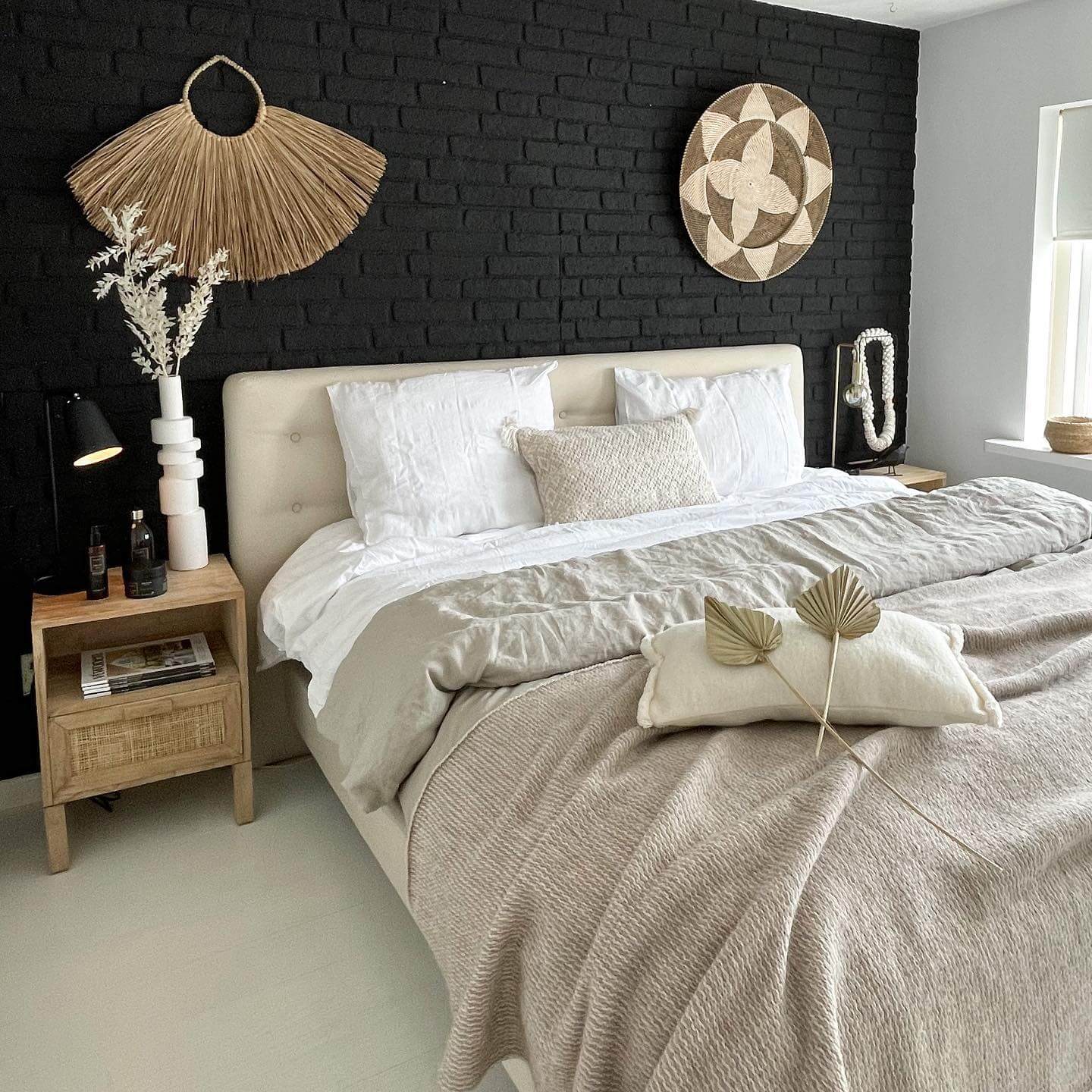 Woven Wall Hangings Add Organic Texture Above Black Brick