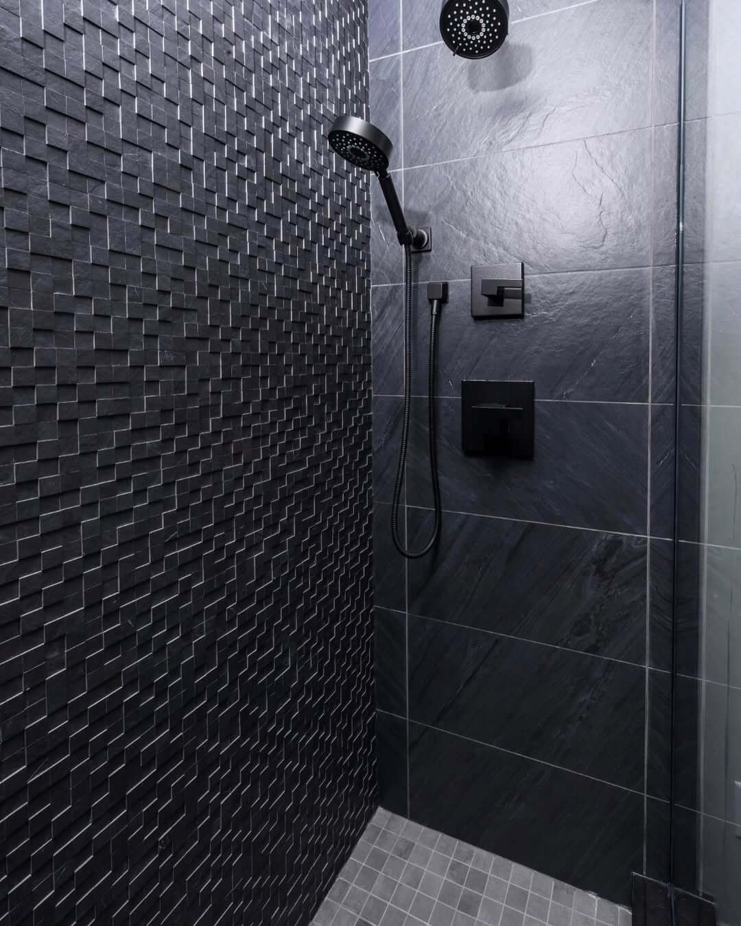Textured Black Tiles Create a Dimensional Shower Feature