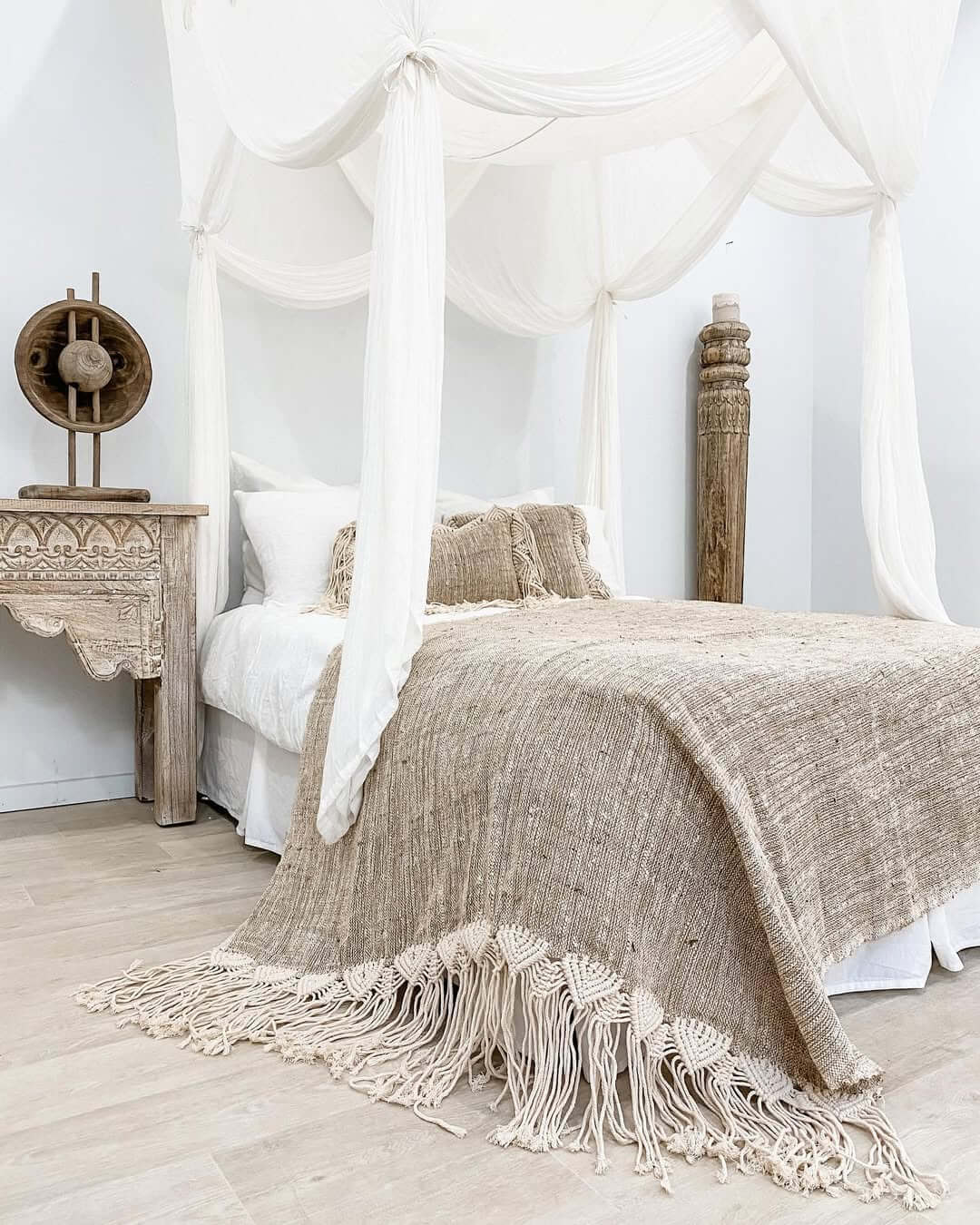 Textured throw adds macrame fringe detail to the bed