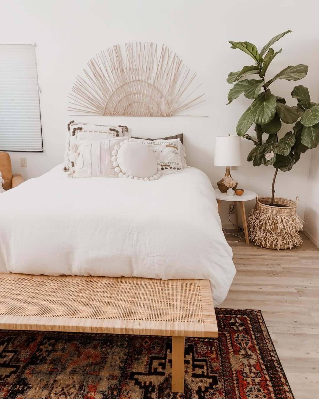 Fan-Shaped Wall Art Adds Organic Texture Above the Bed