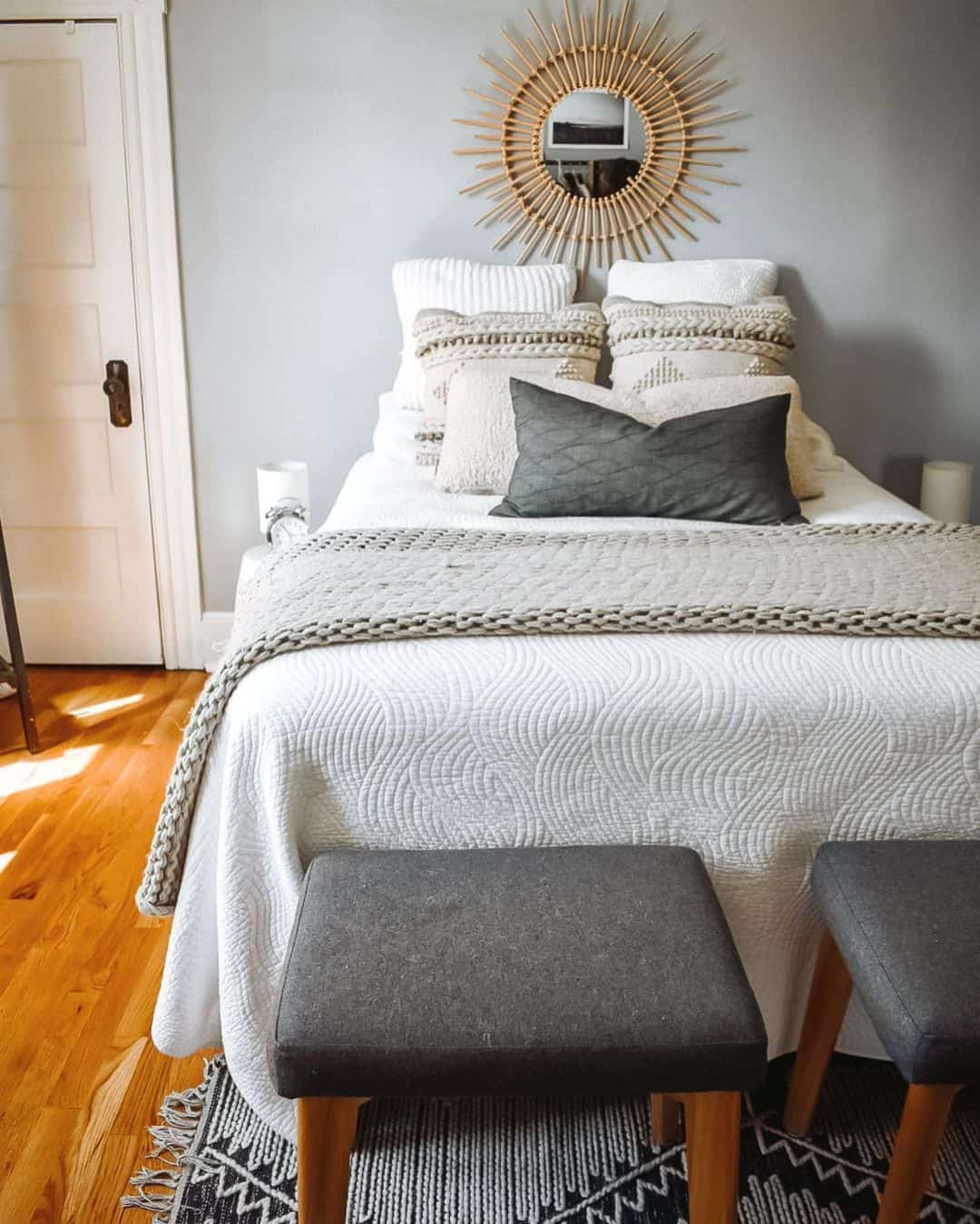Sunburst Mirror Adds Organic Texture Above the Bed
