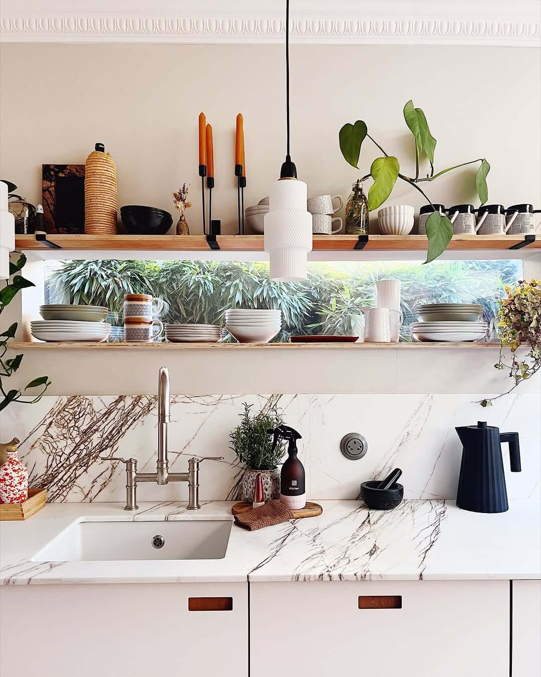 Layered Wood Shelving Frames a Lush Greenery View