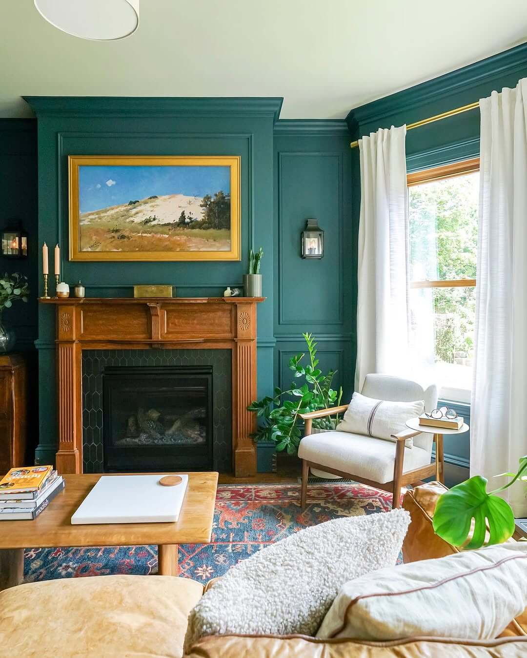 Framed Landscape Artwork Anchors Deep Teal Walls