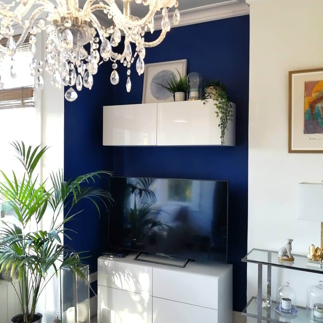 Floating White Cabinets Above TV Create a Clean Focal Point
