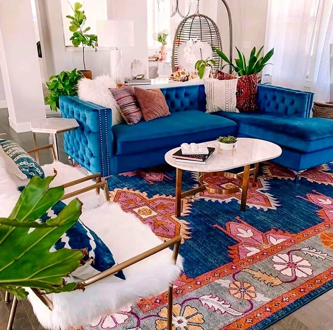 Pair a Tufted Blue Velvet Sofa with a Geometric Rug