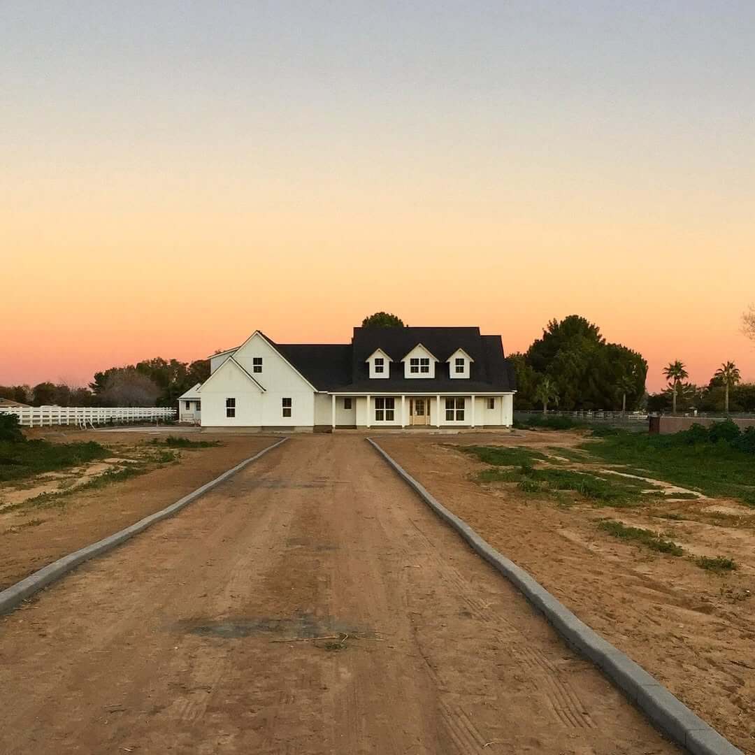 Three Dormers Create a Classic White Farmhouse Roofline