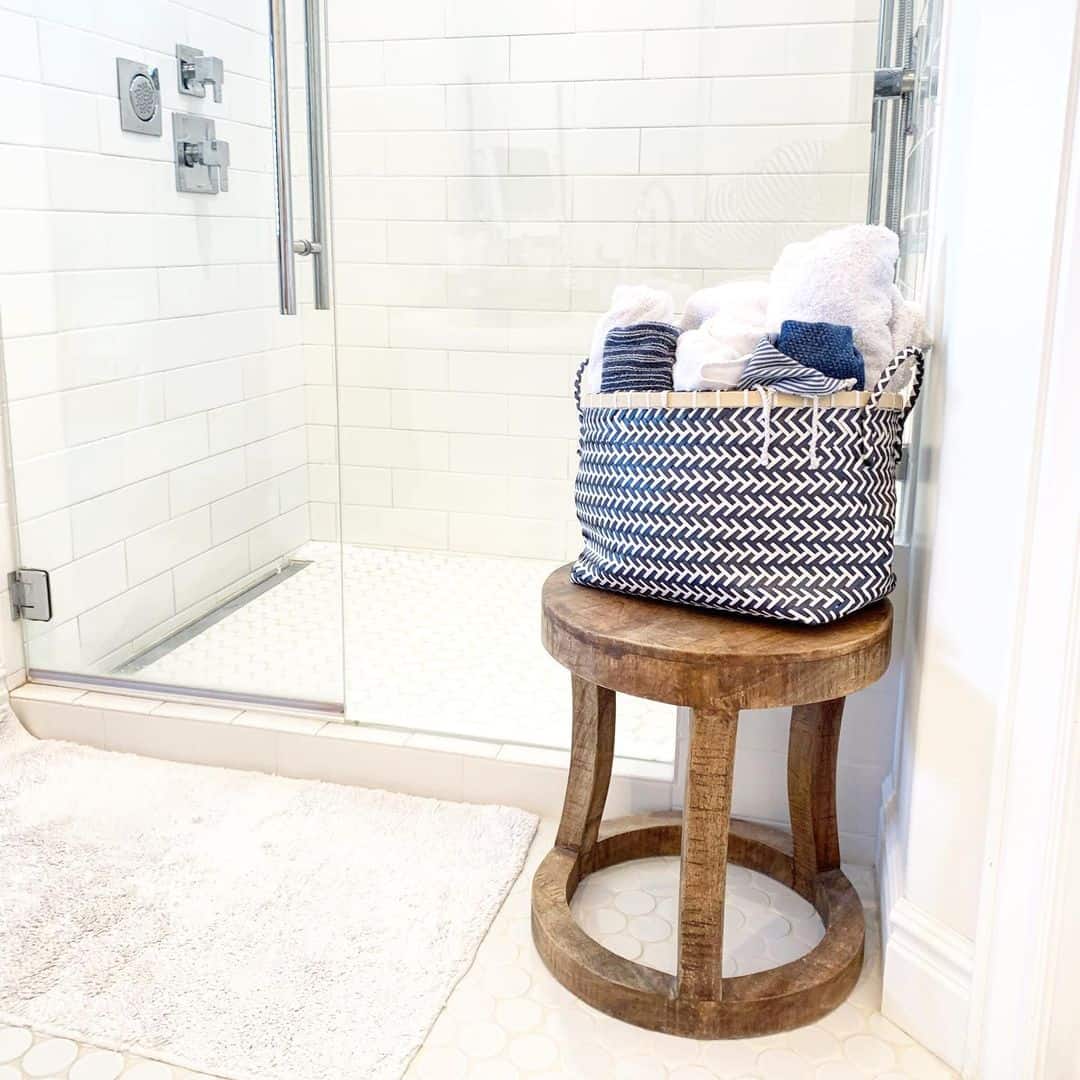 Patterned Basket on Rustic Stool Holds Extra Towels