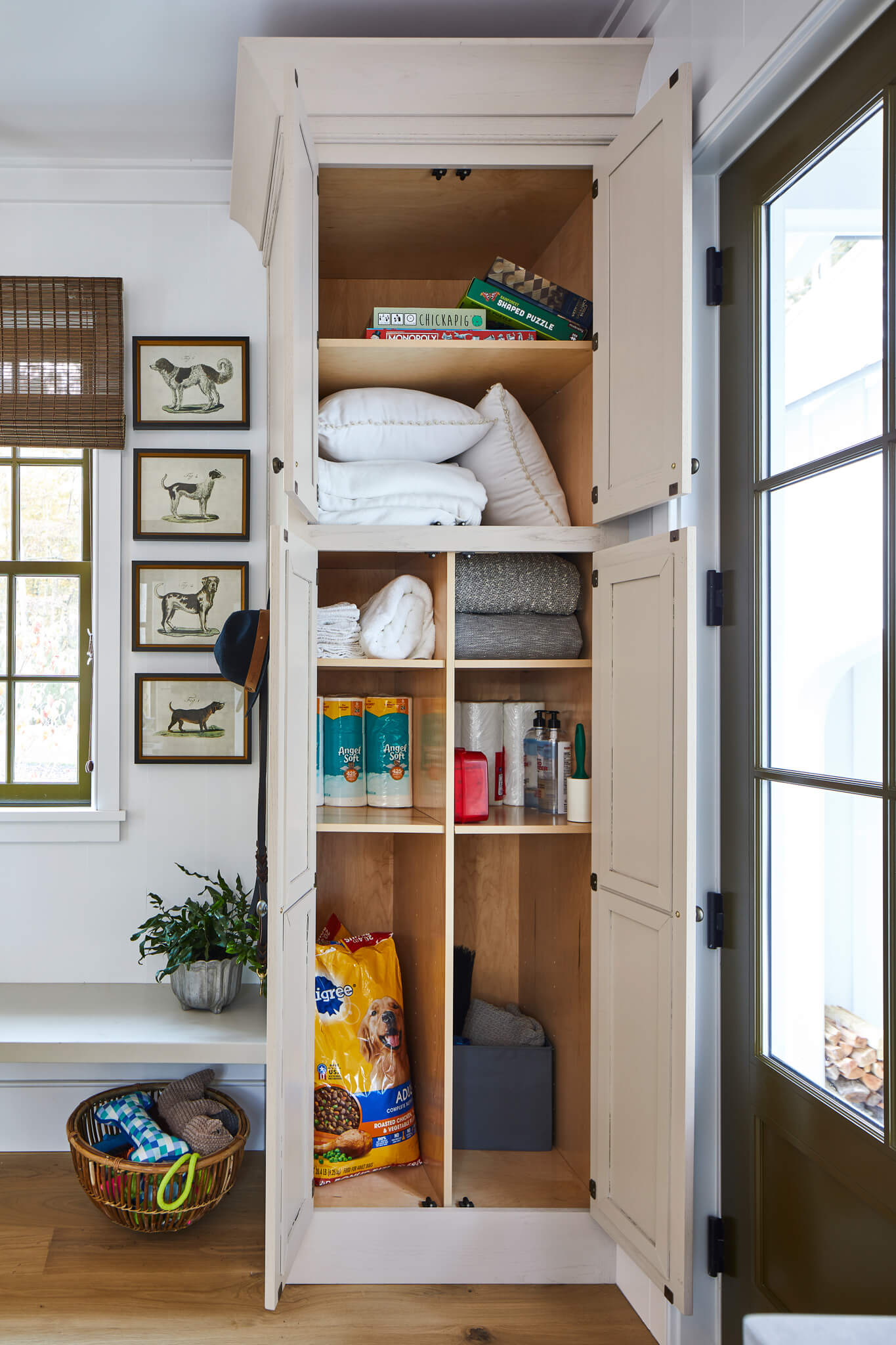 Tall Cabinet Sections Keep Pet Food and Linens Separate