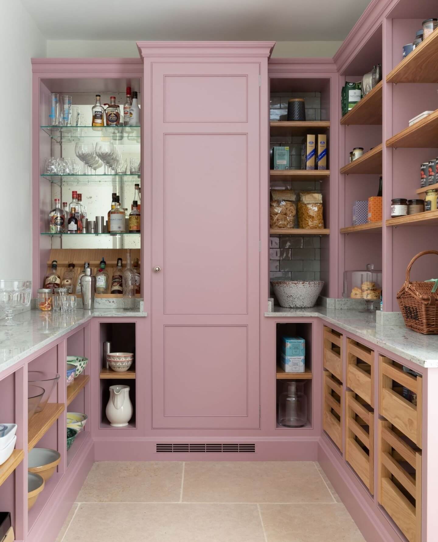 Pink Pantry Cabinets With Mirrored Backsplash and Glass Shelving